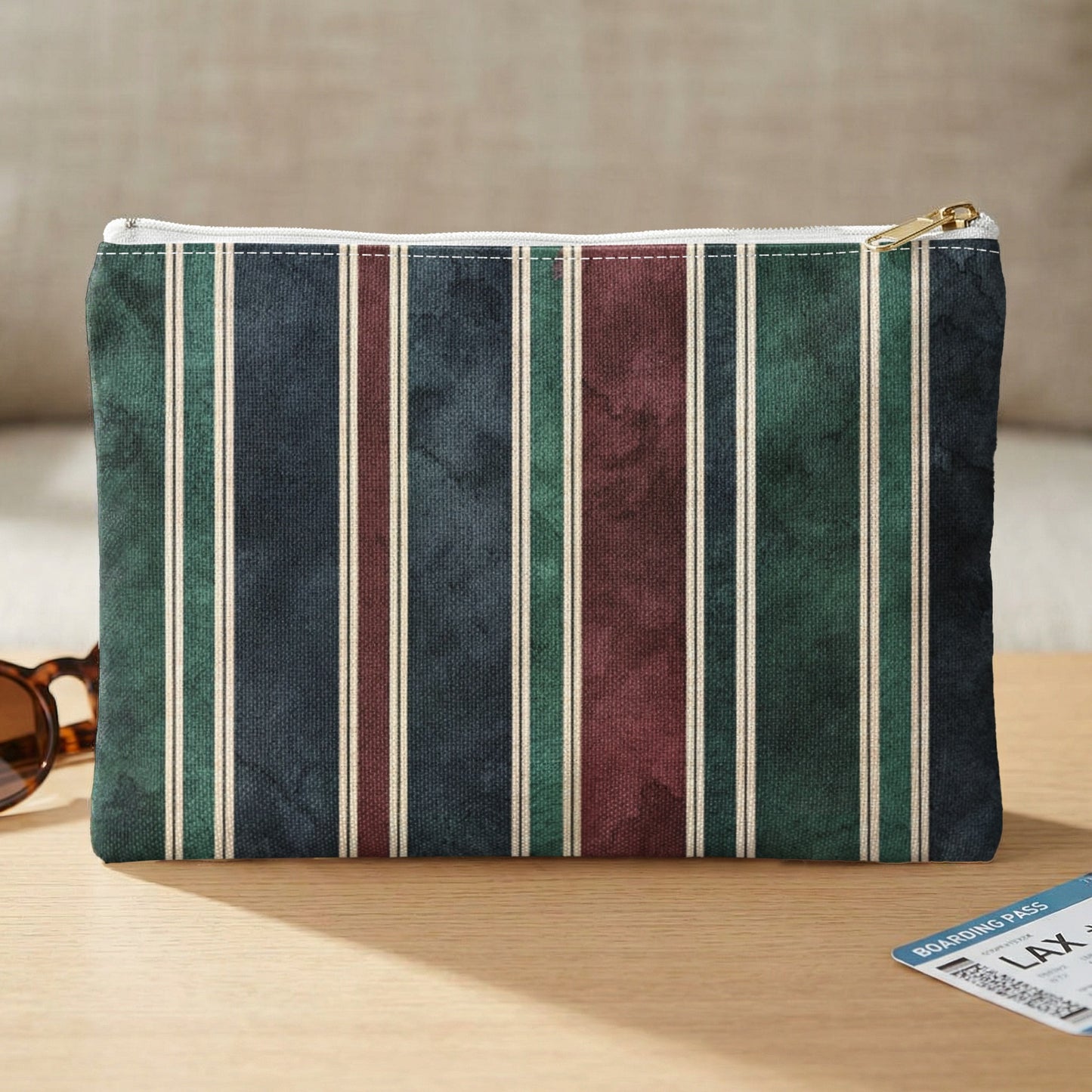 Pouch with vertical stripes in green, navy, burgundy, and off-white stripes.