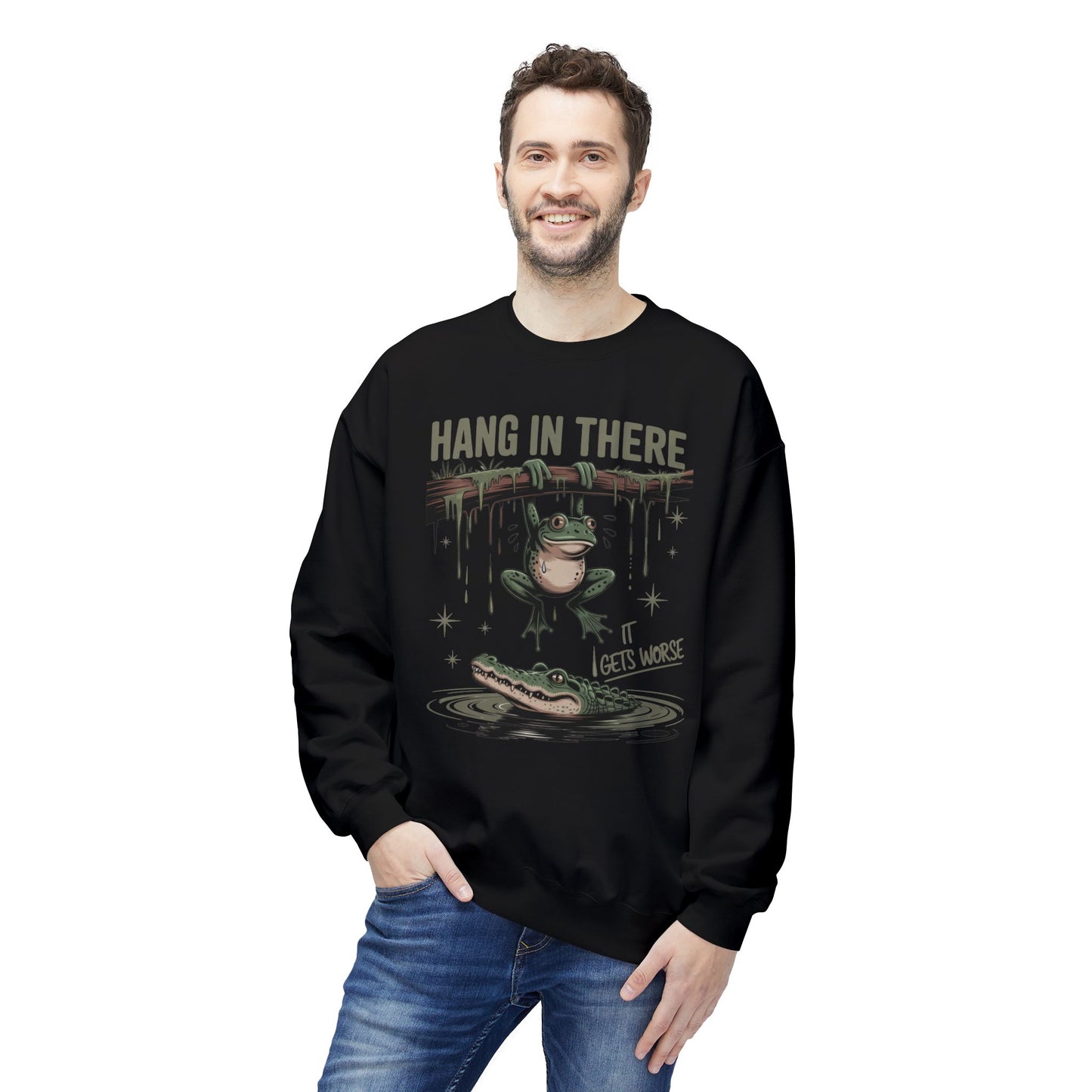Black sweatshirt with graphic of a frog hanging from a branch above an alligator.