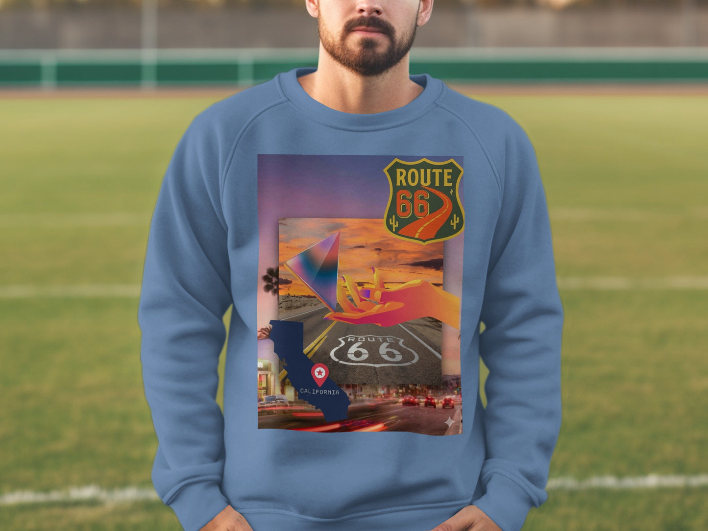 Route 66 graphic on a blue sweatshirt, featuring a sunset and car trails.