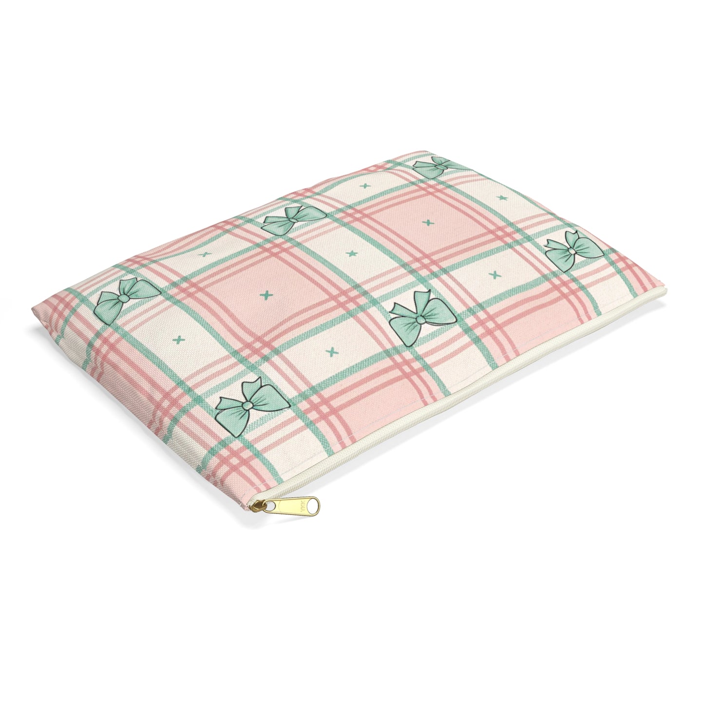 Plaid pillow with pastel pink, green lines, and teal bow pattern.