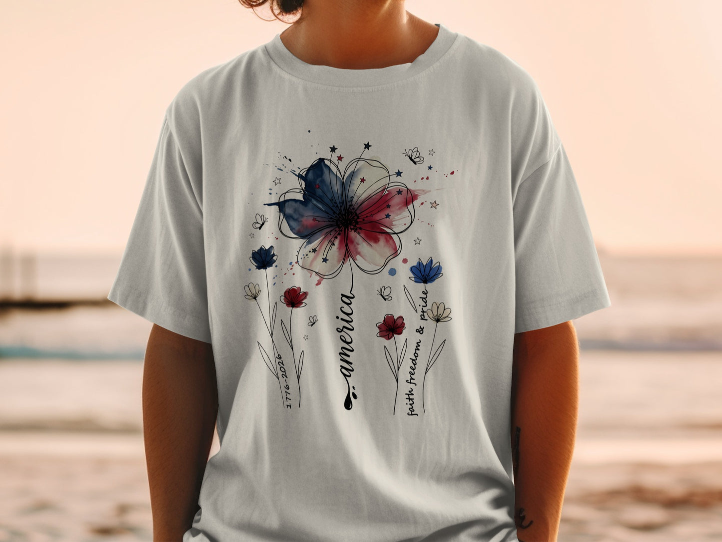T-shirt with patriotic floral design and "America" text.