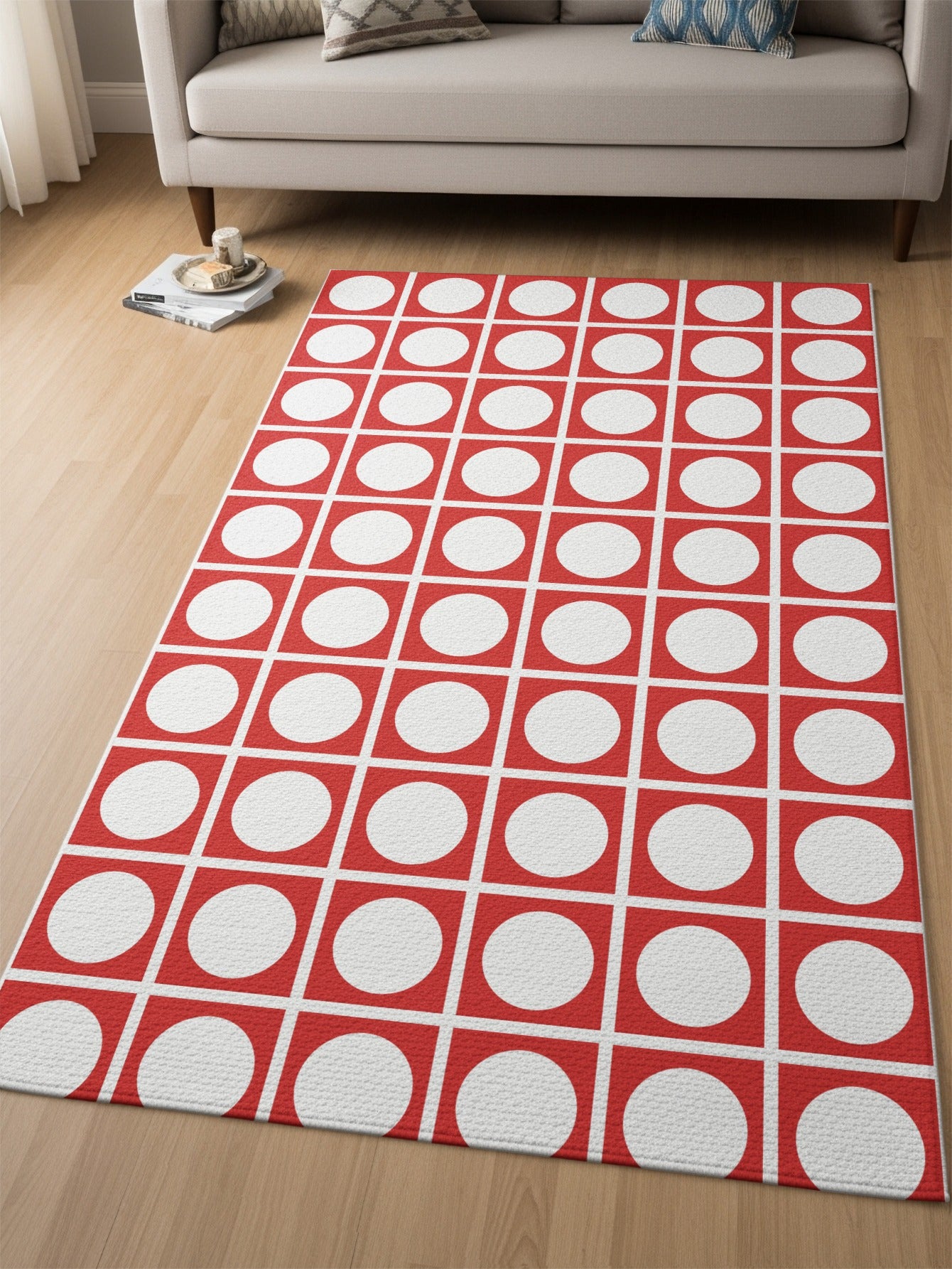 Red and white geometric rug with circles inside squares pattern.