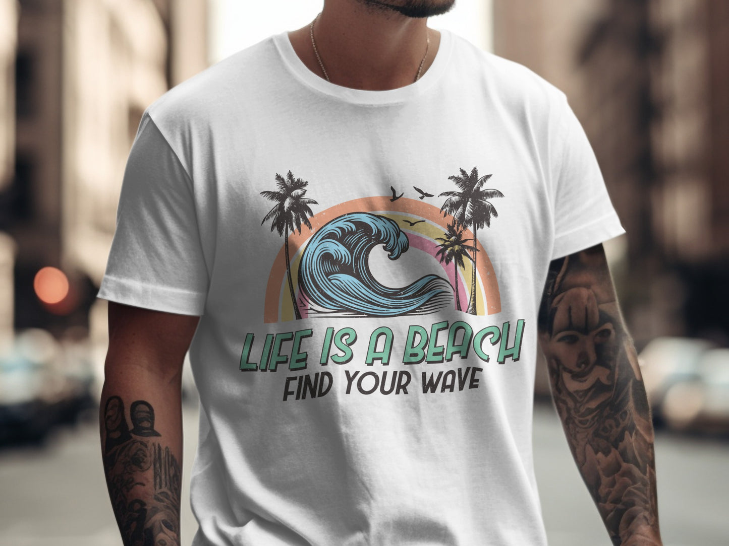 White t-shirt with ocean wave, palm trees, and "Find Your Wave" text.
