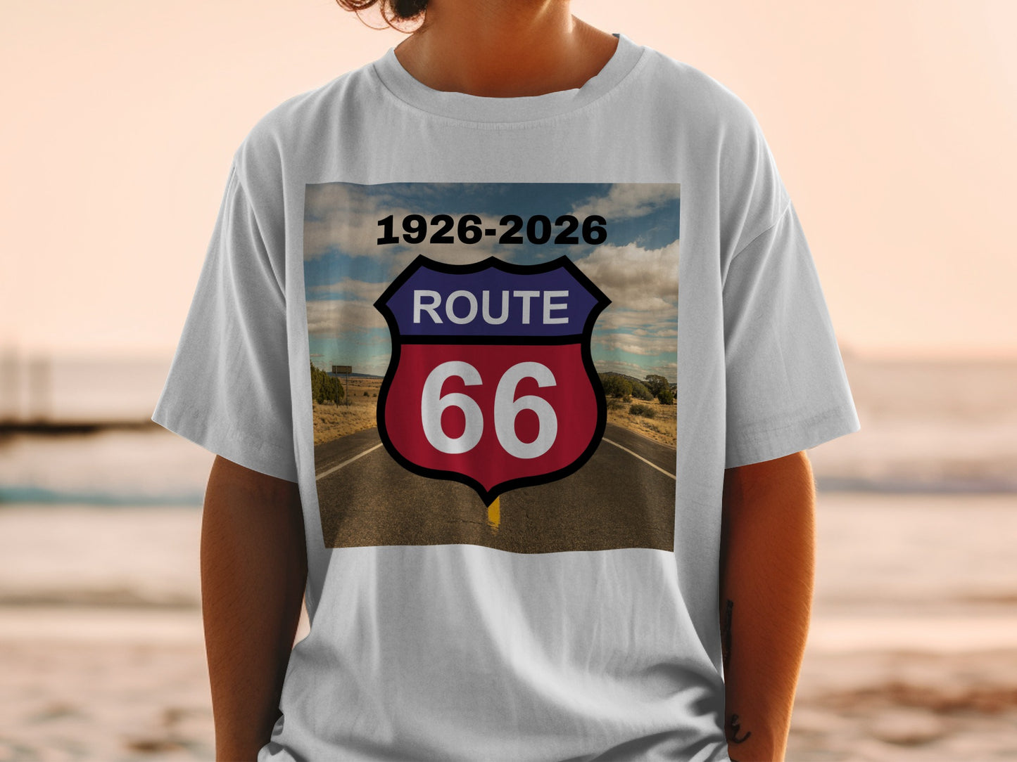 T-shirt with Route 66 shield logo featuring road and sky.