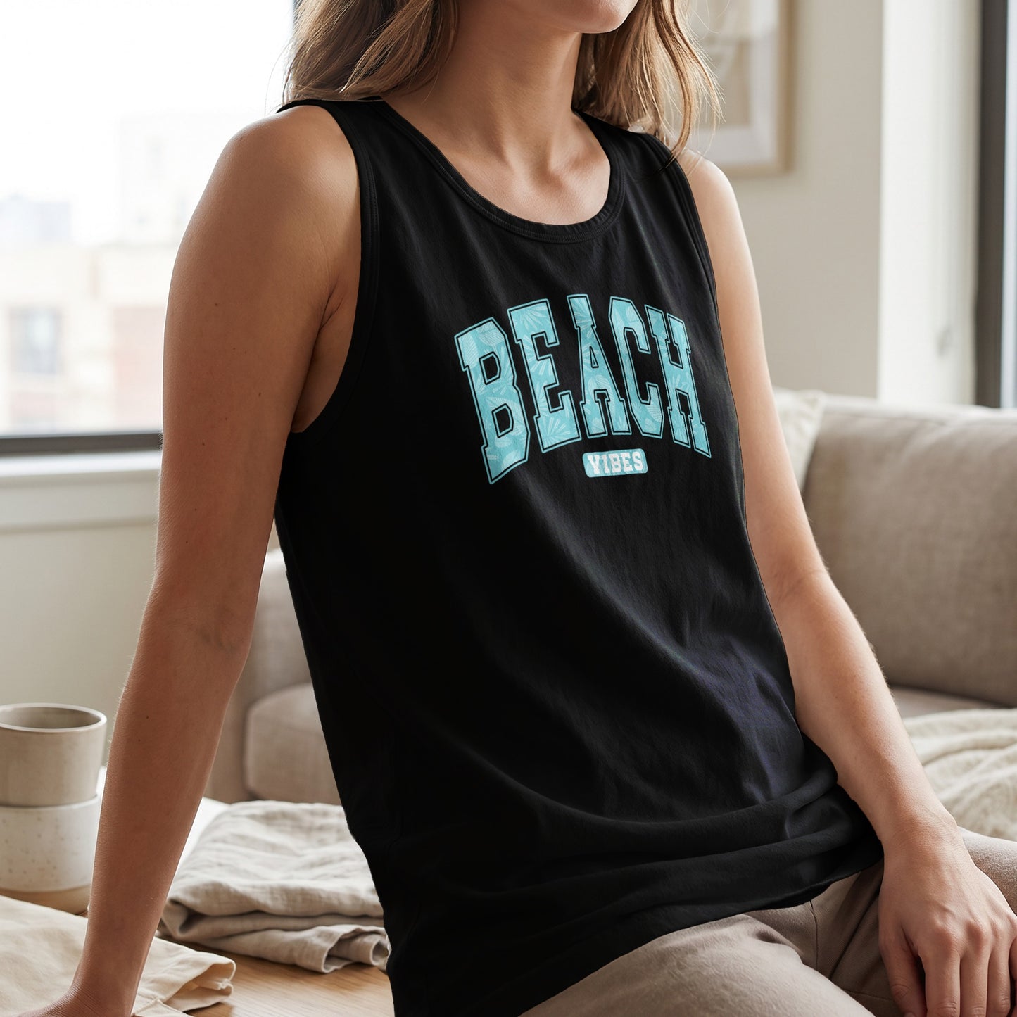 Black tank top with "BEACH VIBES" text across the chest.