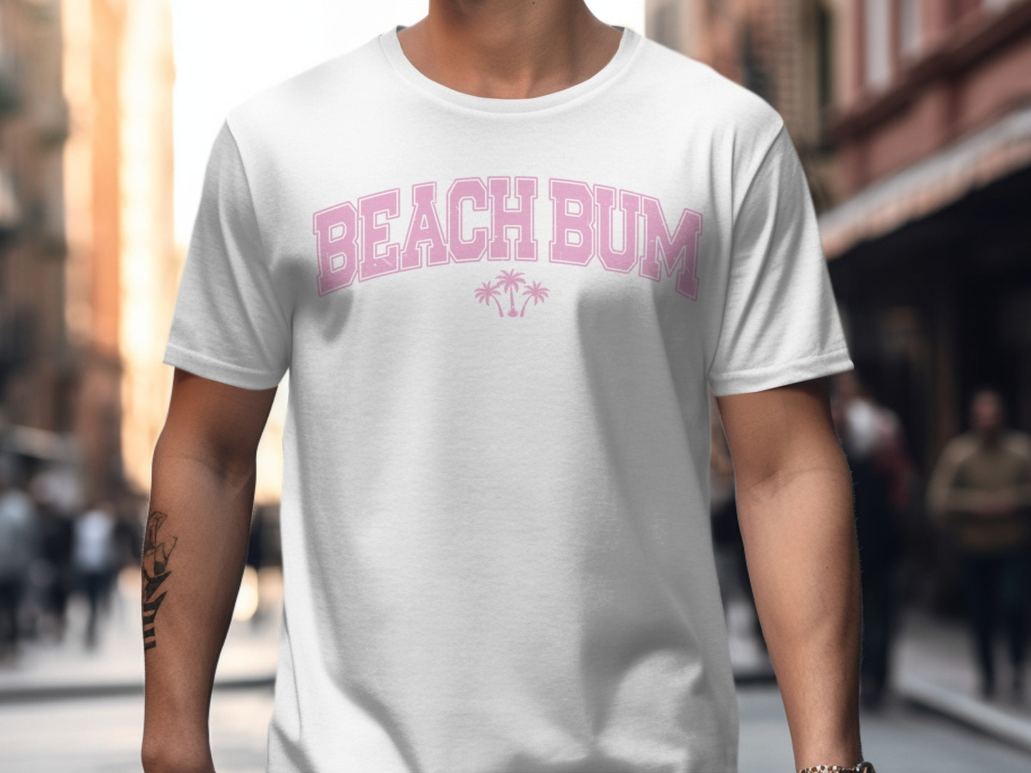 White t-shirt with "BEACH BUM" in pink lettering and palm tree graphics.