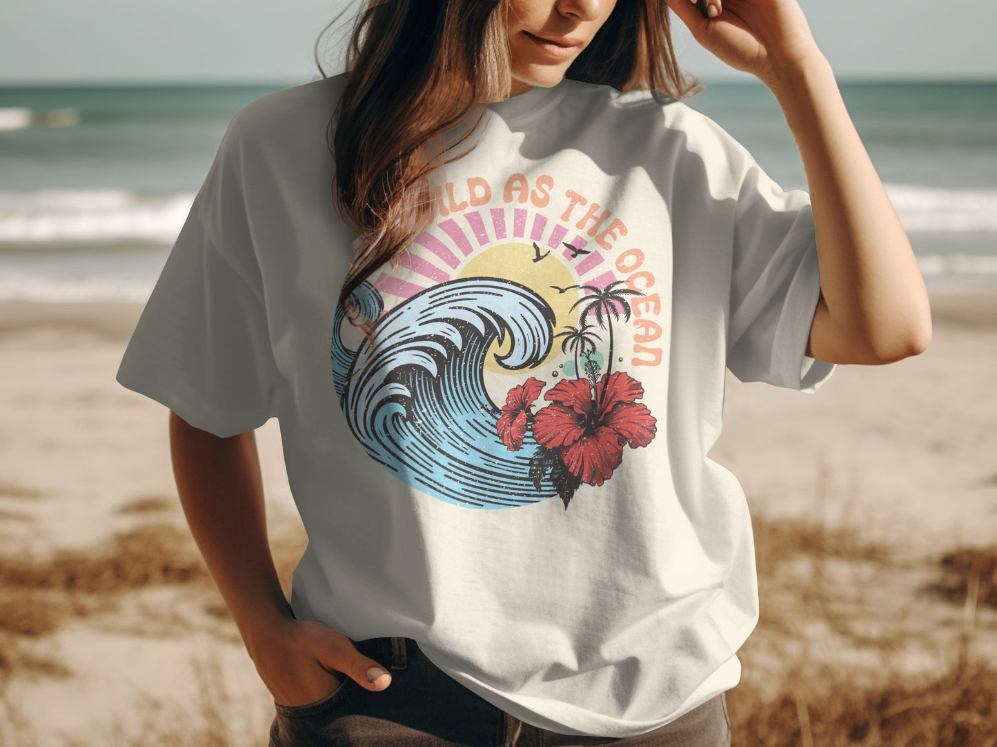T-shirt with distressed graphic of wave, palm trees, hibiscus, and sun.