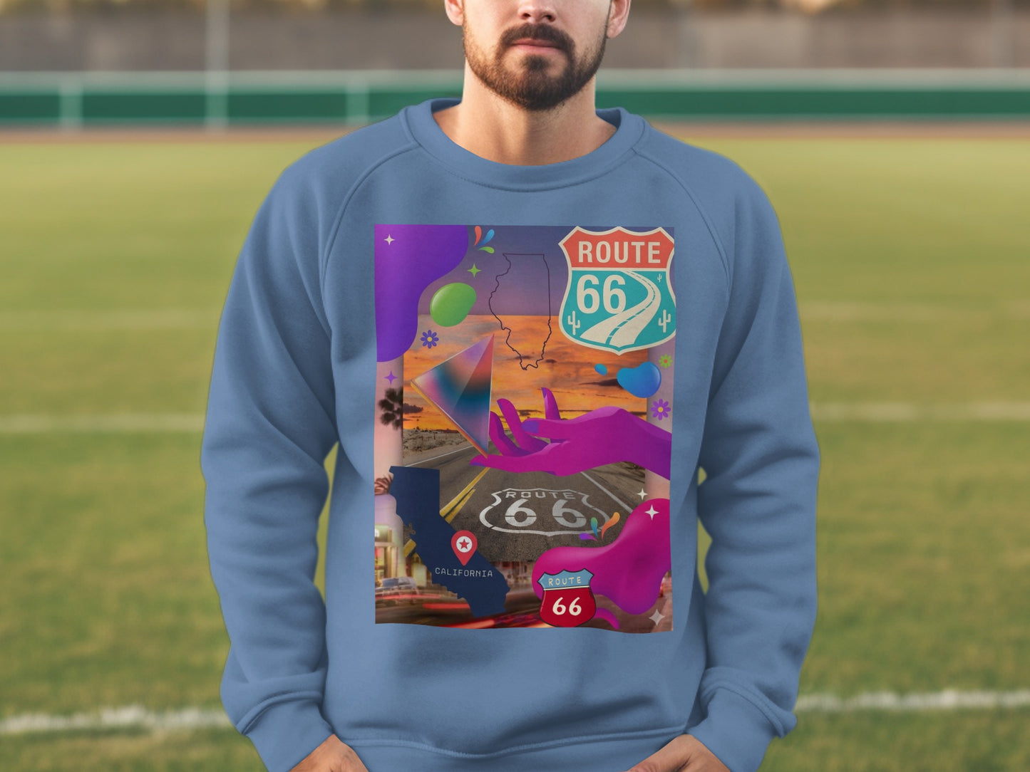 Blue sweatshirt with Route 66 collage graphic featuring maps and desert imagery.