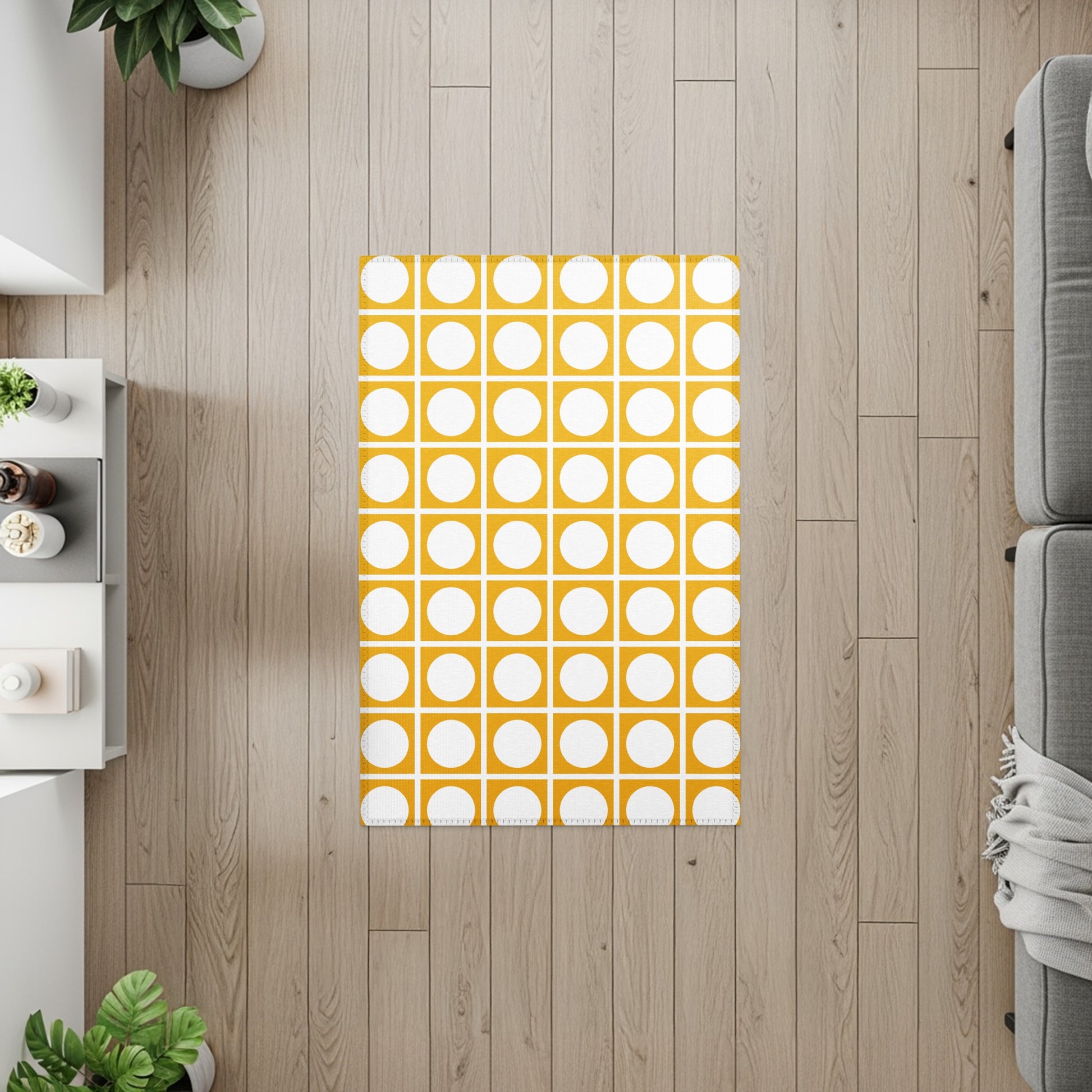 Yellow rug with white circles in a grid pattern on a wood floor