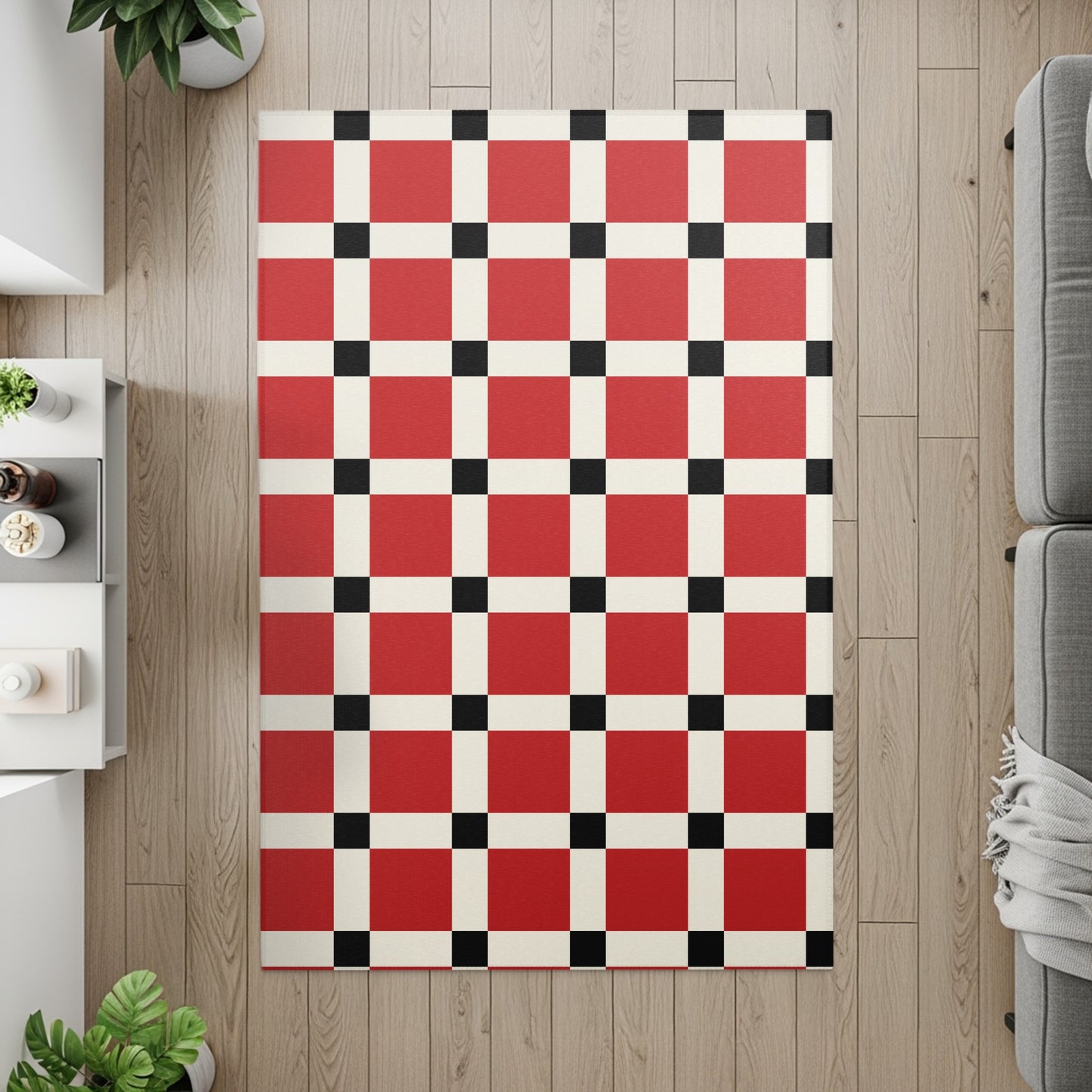 Red, cream, and black checkered rug on a wood floor with furniture accents.