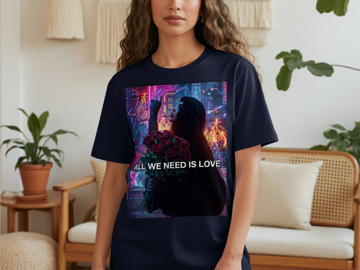 Woman wearing a dark t-shirt with "ALL WE NEED IS LOVE" and neon city graphic.