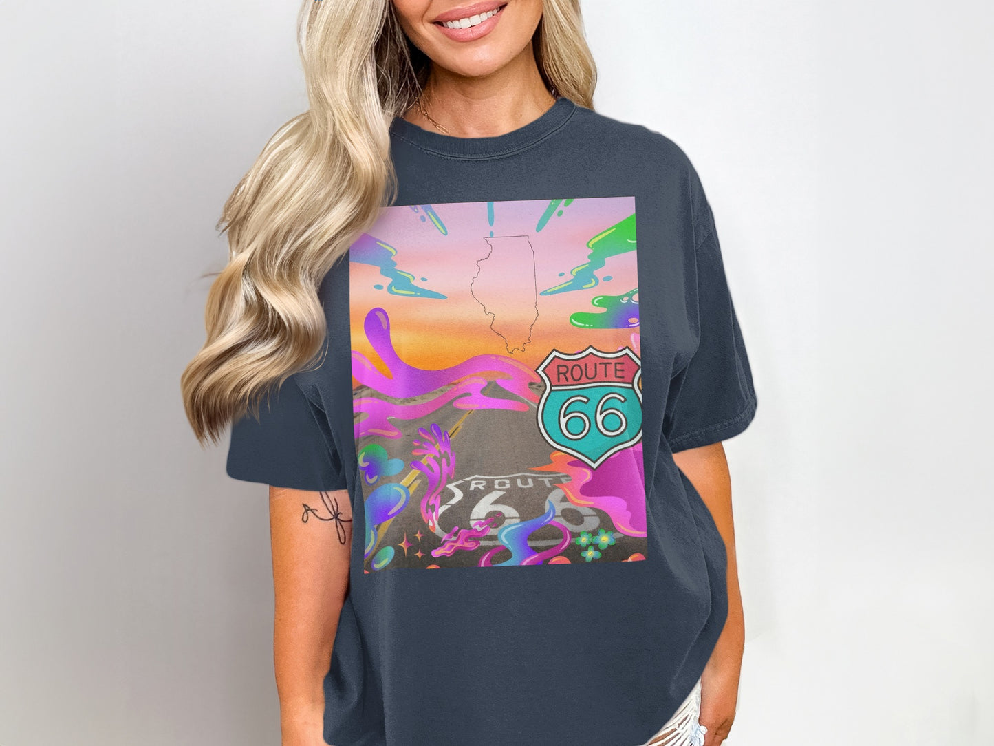 T-shirt featuring Route 66 logo with colorful, abstract background.