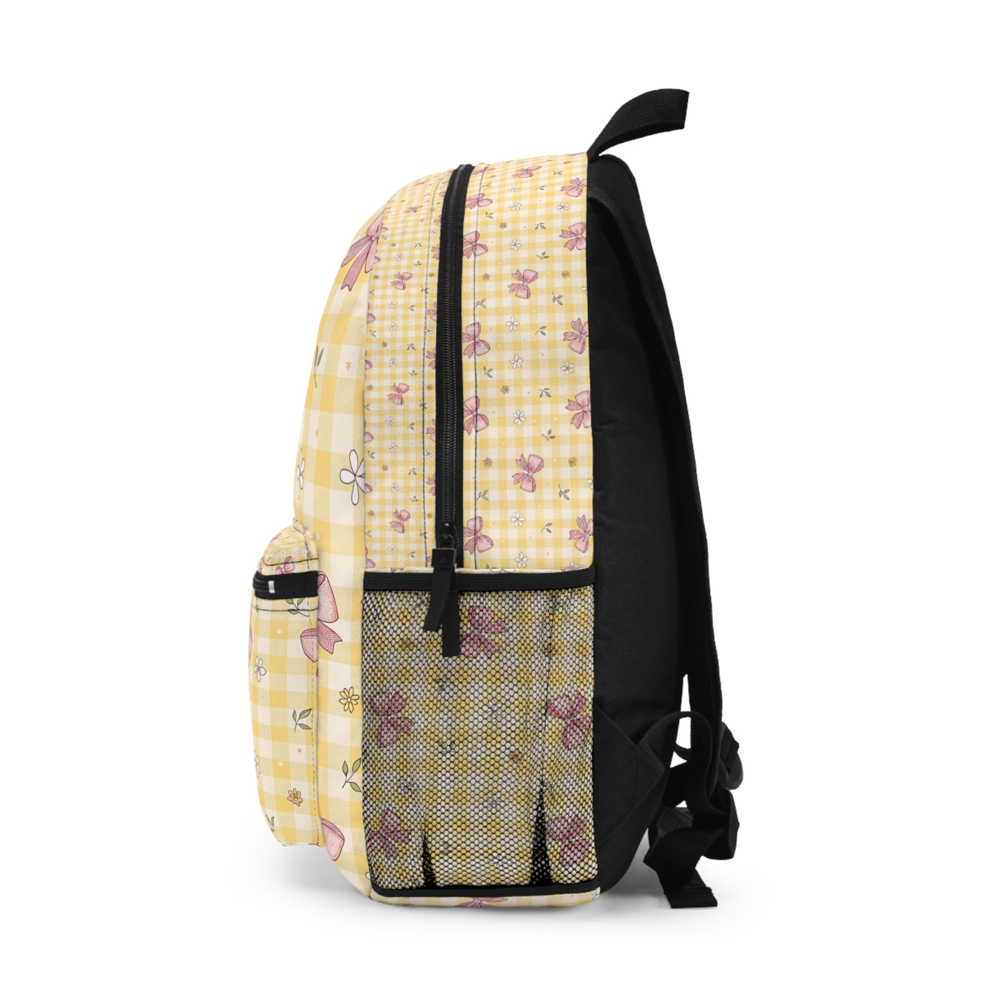 Yellow checkered backpack with pink bows and flowers pattern.