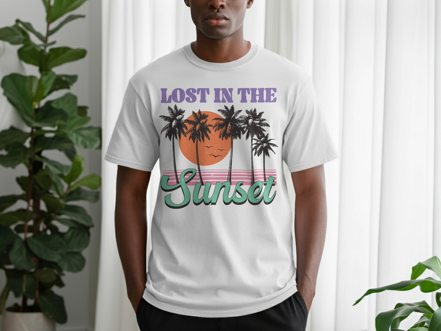 White t-shirt with "Lost in the Sunset" text and palm trees.