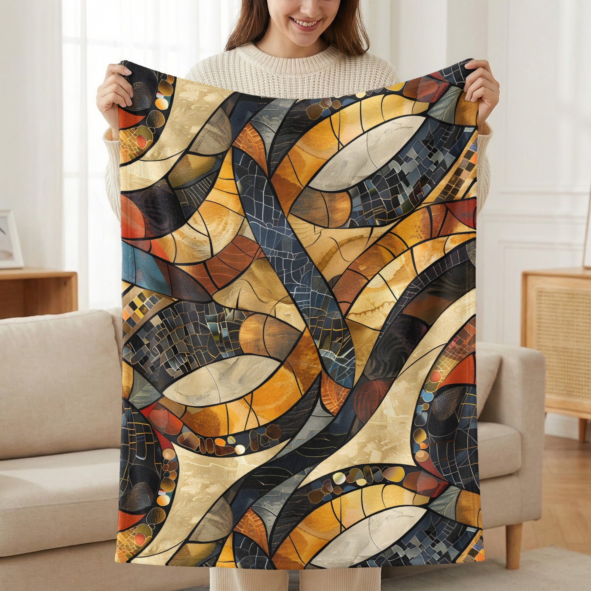 Abstract stained glass pattern blanket with orange, blue, and golden hues.