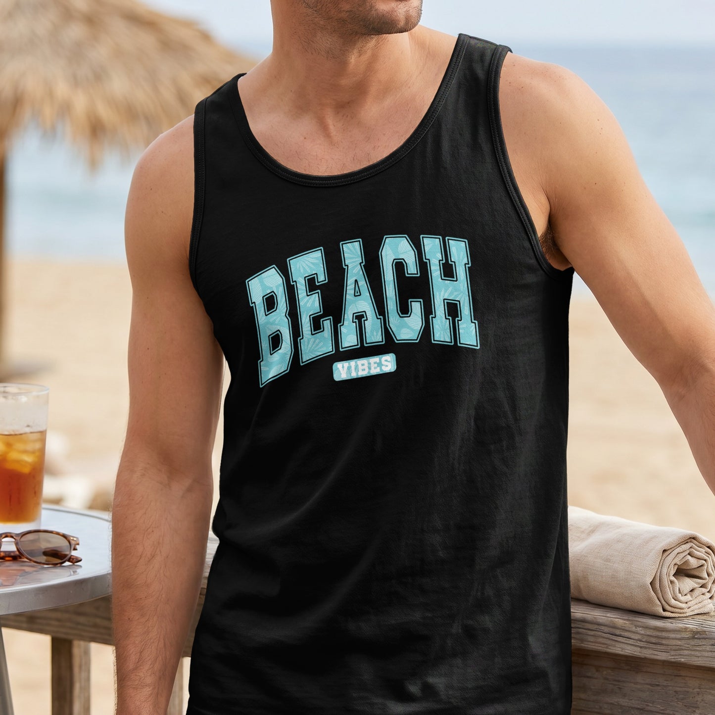 Black tank top with "Beach Vibes" text on chest, worn by a man.