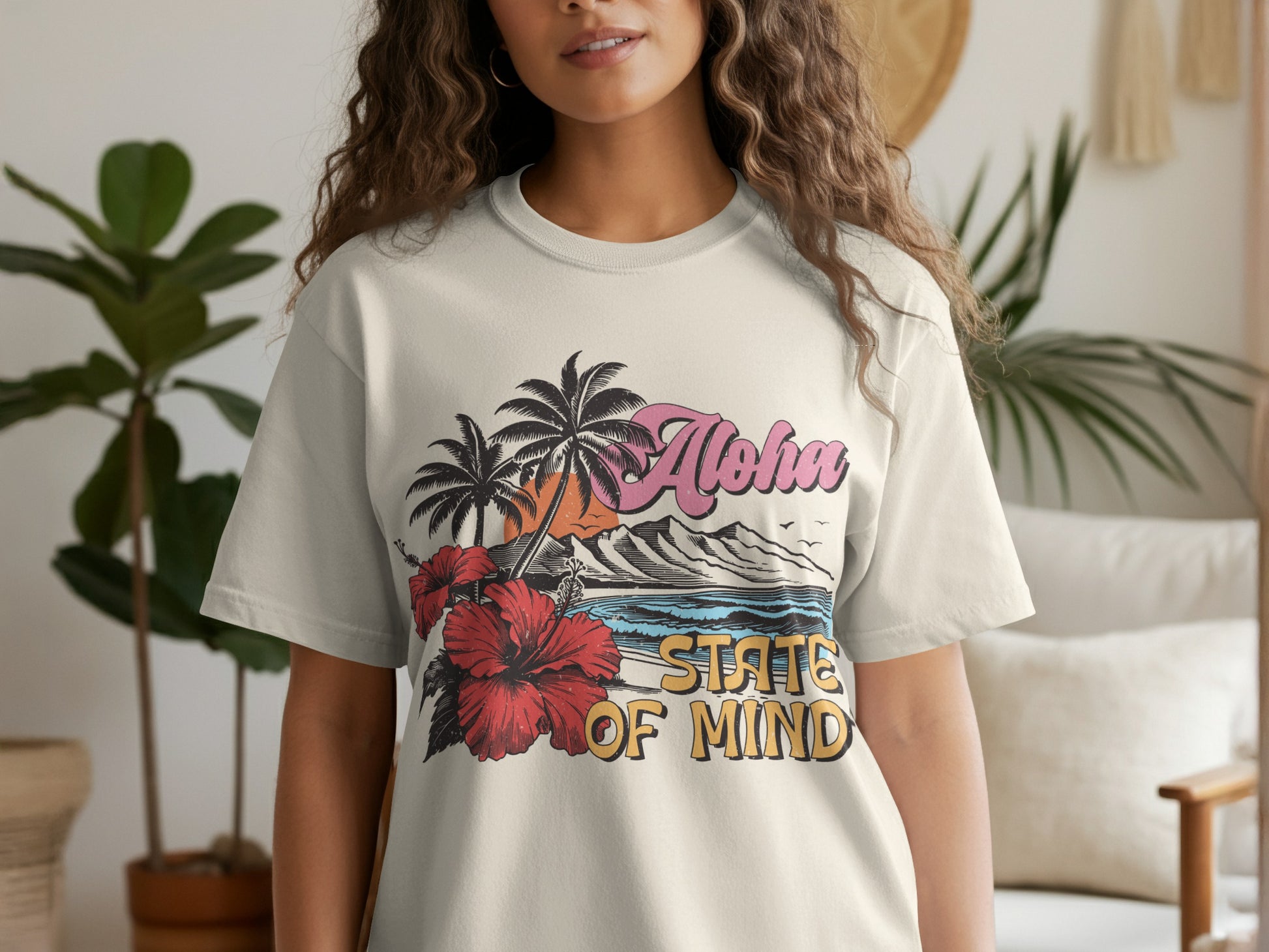 Cream t-shirt with "Aloha State of Mind" text and tropical beach scene.