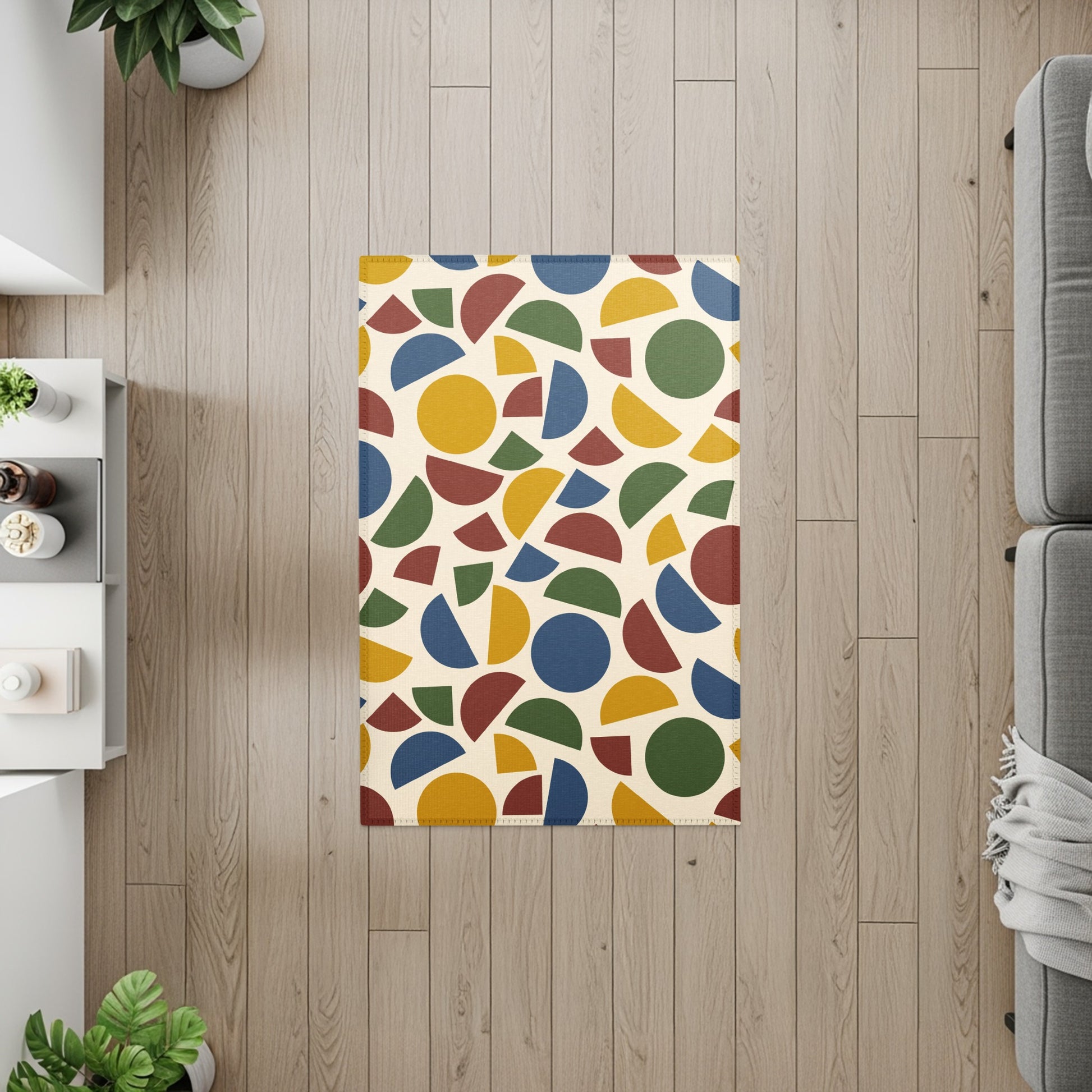 Rug with cream background and abstract geometric shapes in blue, red, yellow, and green.
