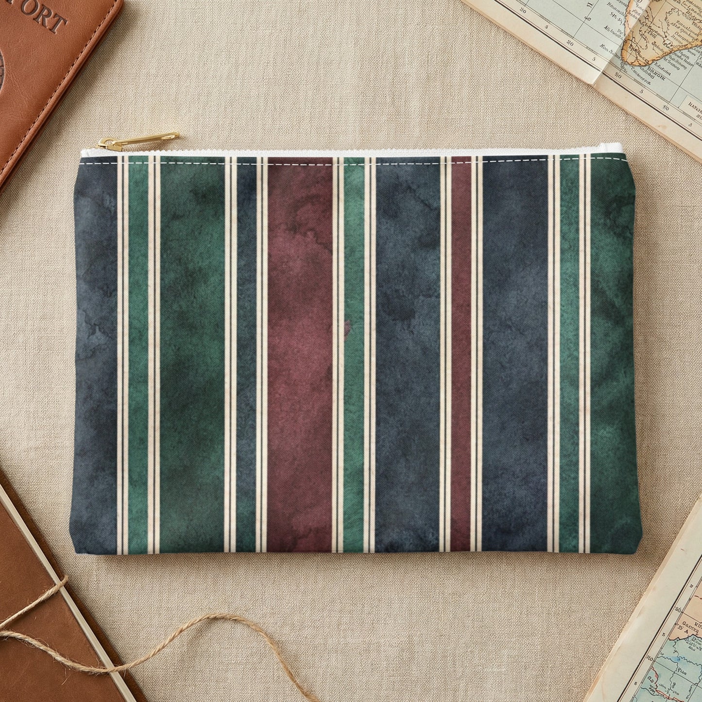 Striped makeup bag with burgundy, green, and navy vertical stripes.