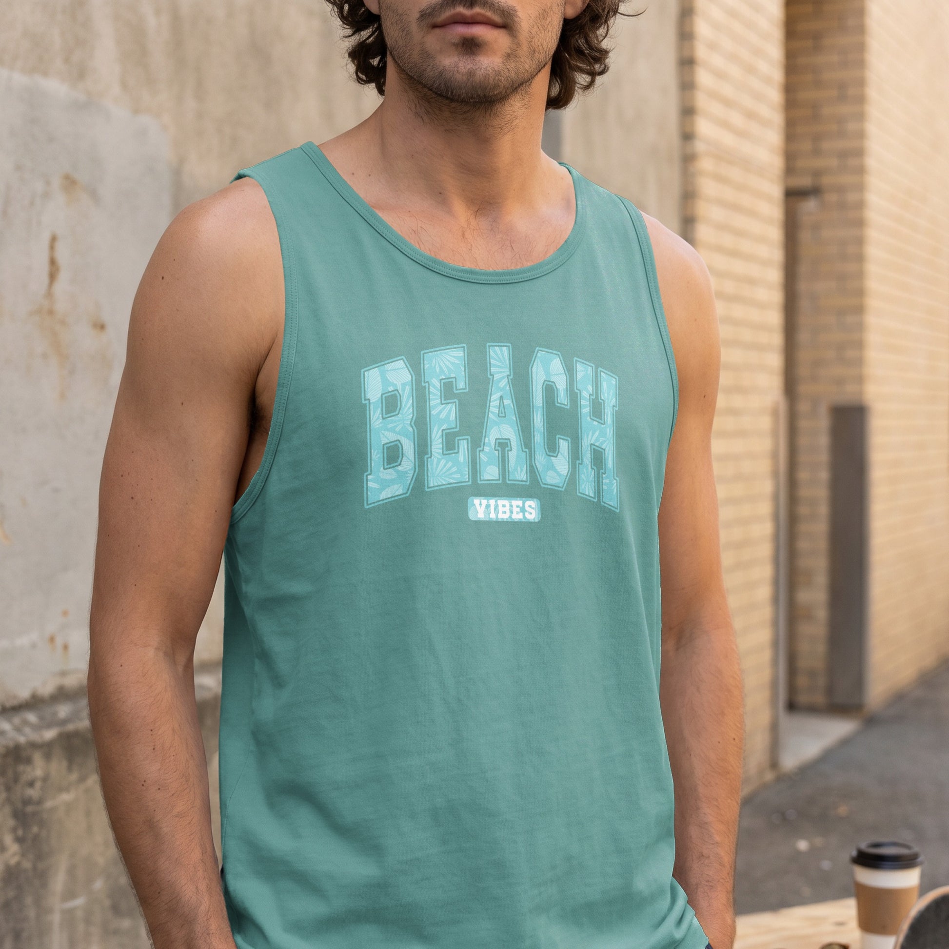Teal tank top with "BEACH VIBES" text and tropical leaf pattern.