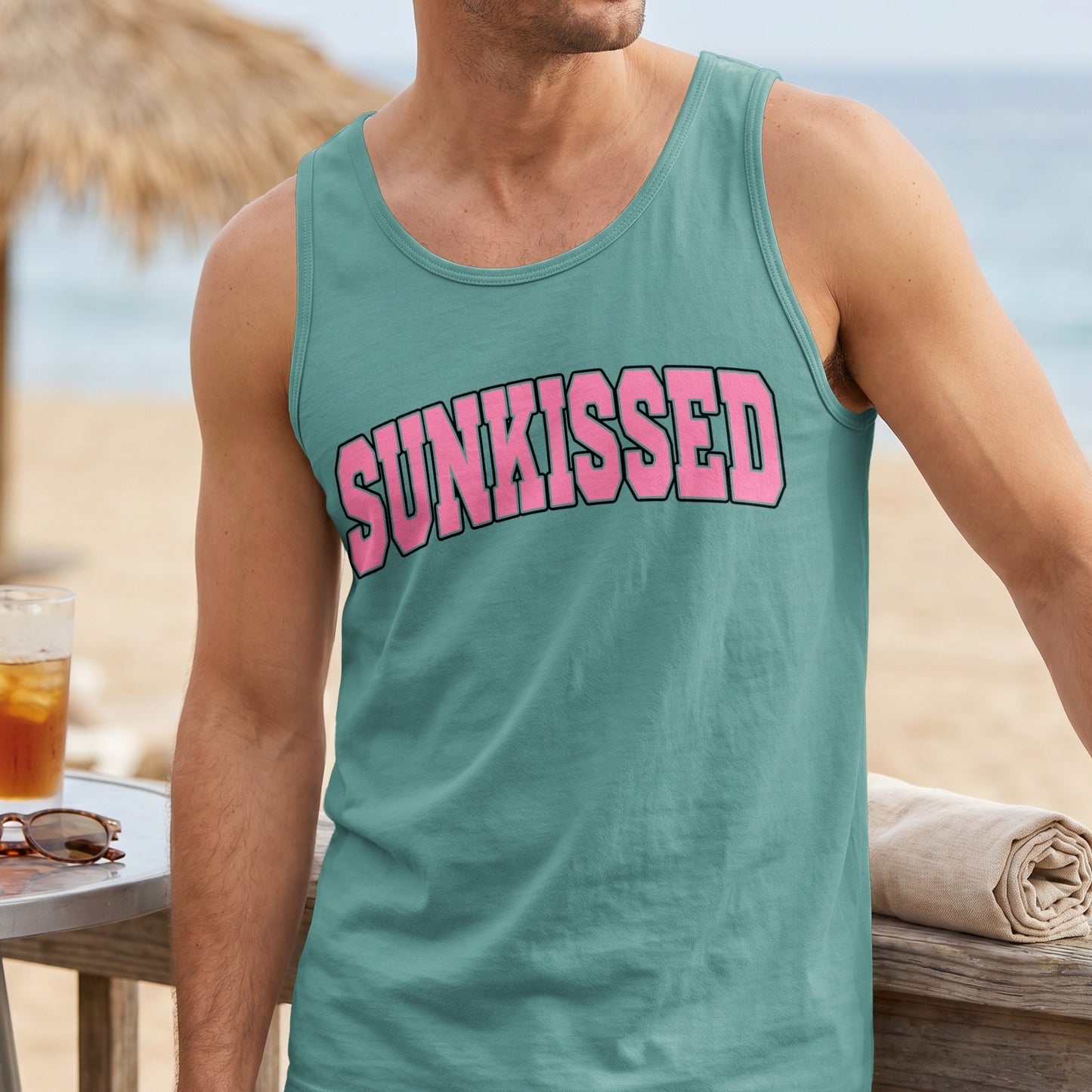 Teal tank top with "SUNKISSED" in pink block letters.