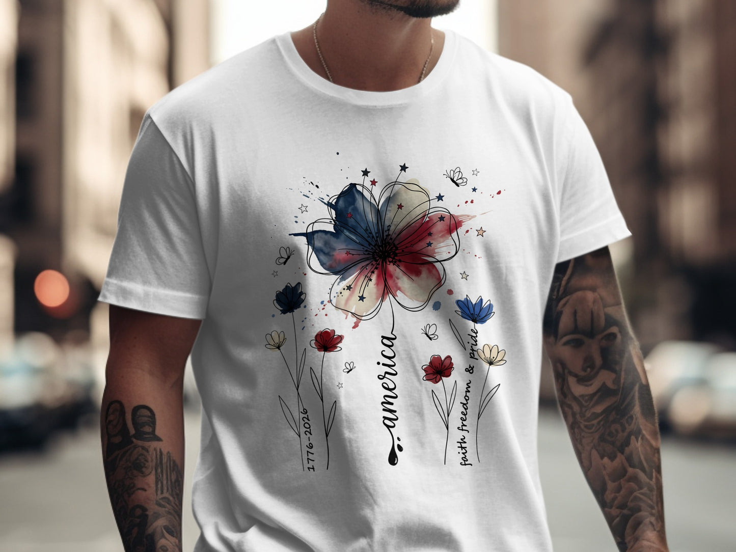 White t-shirt with patriotic flower design and text "america" and "faith, freedom & pride."