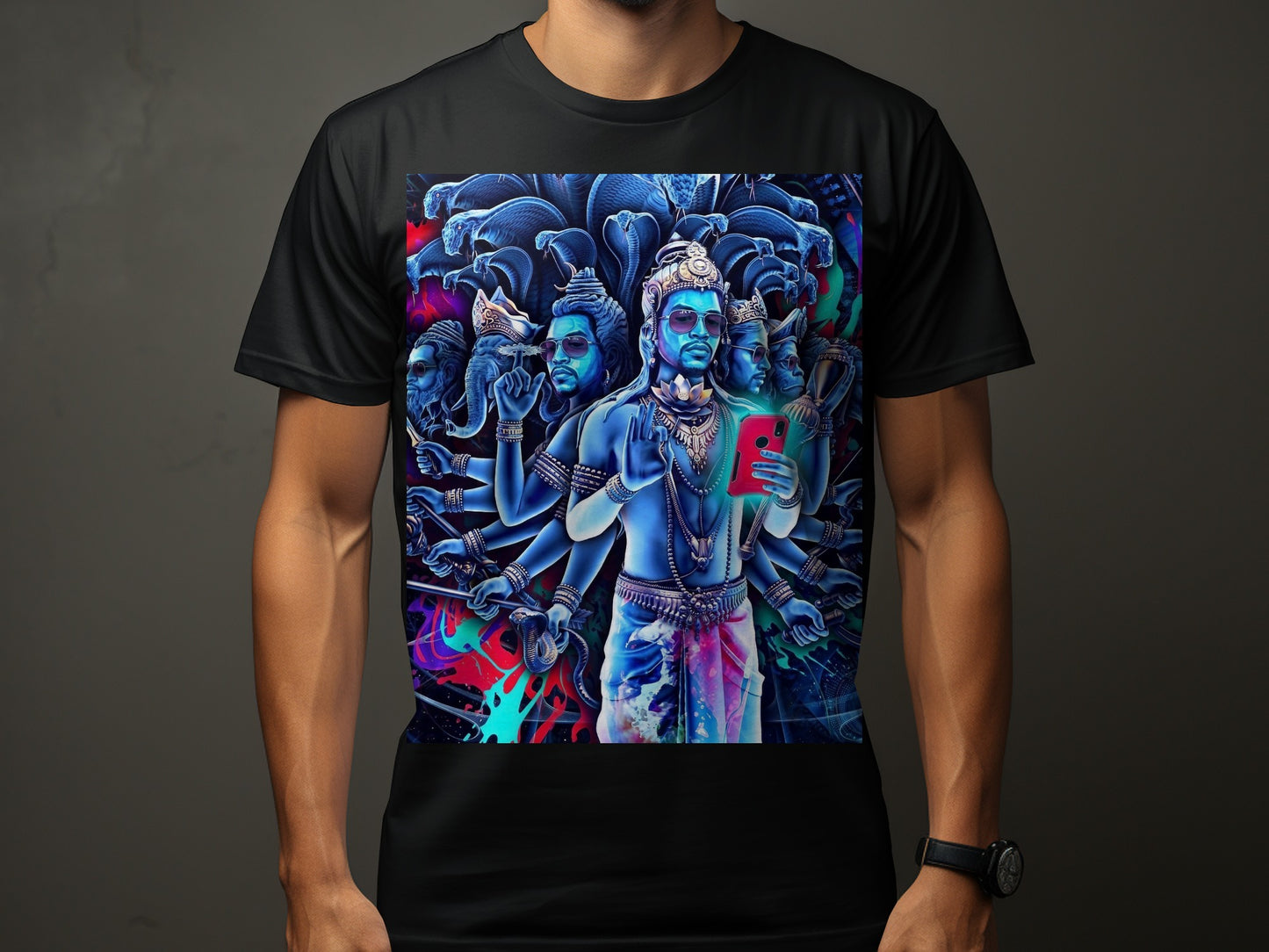 Man in black t-shirt wearing shirt with multi-armed Hindu deity holding a smartphone.