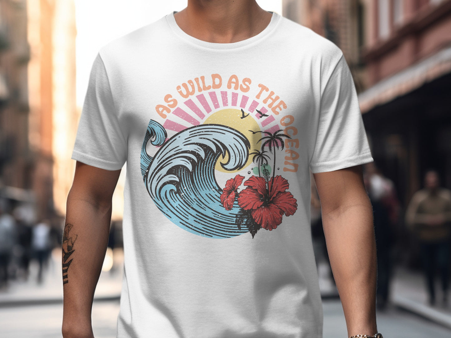 White t-shirt with colorful vintage ocean wave and palm tree graphic.