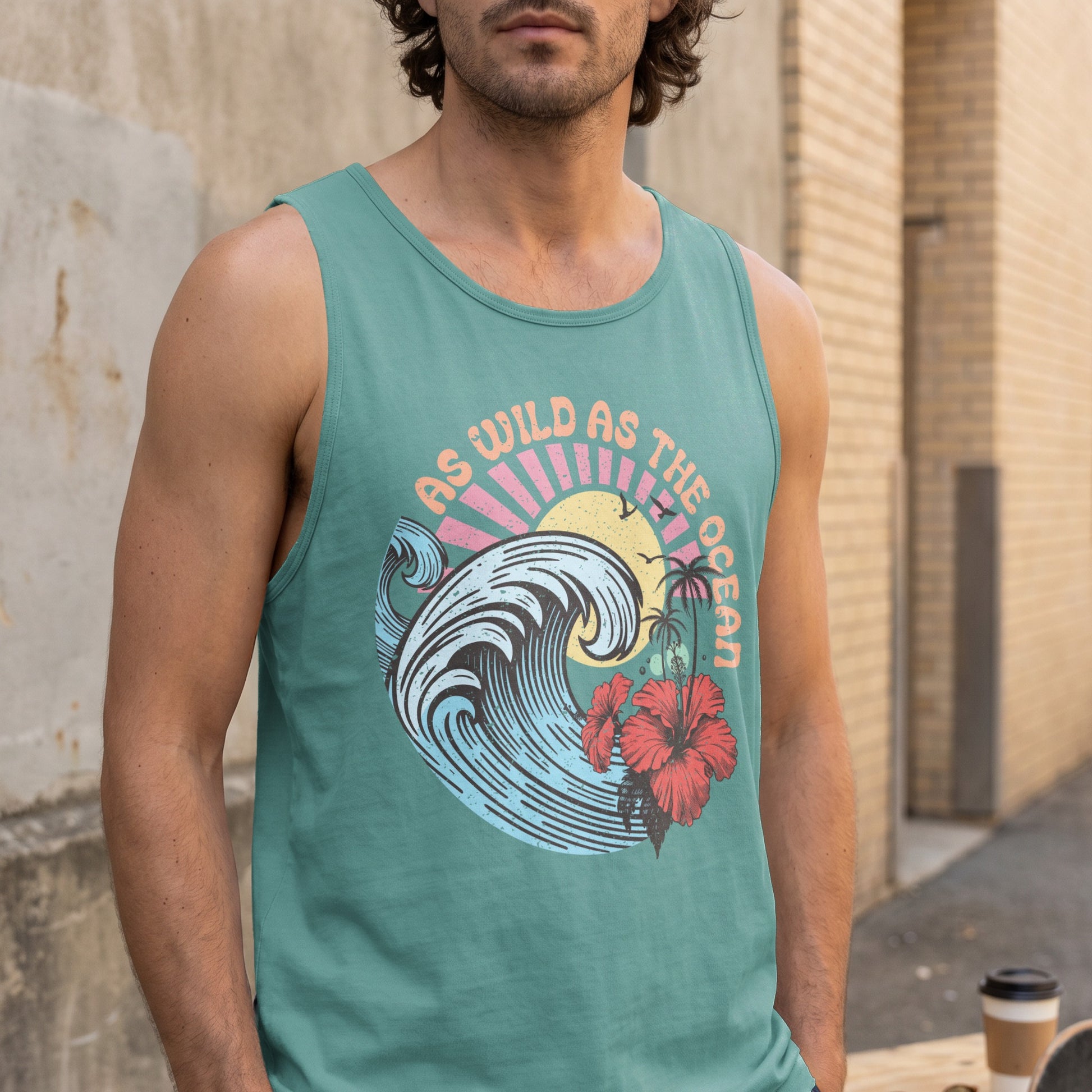 Teal tank top with wavy ocean, hibiscus, and sun graphic and "As wild as the ocean" text.