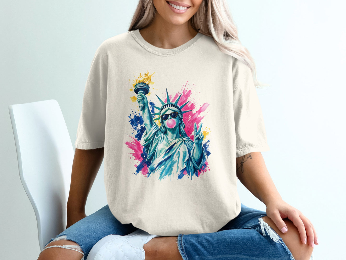 Statue of Liberty blowing bubble gum with peace sign, on watercolor splash background.