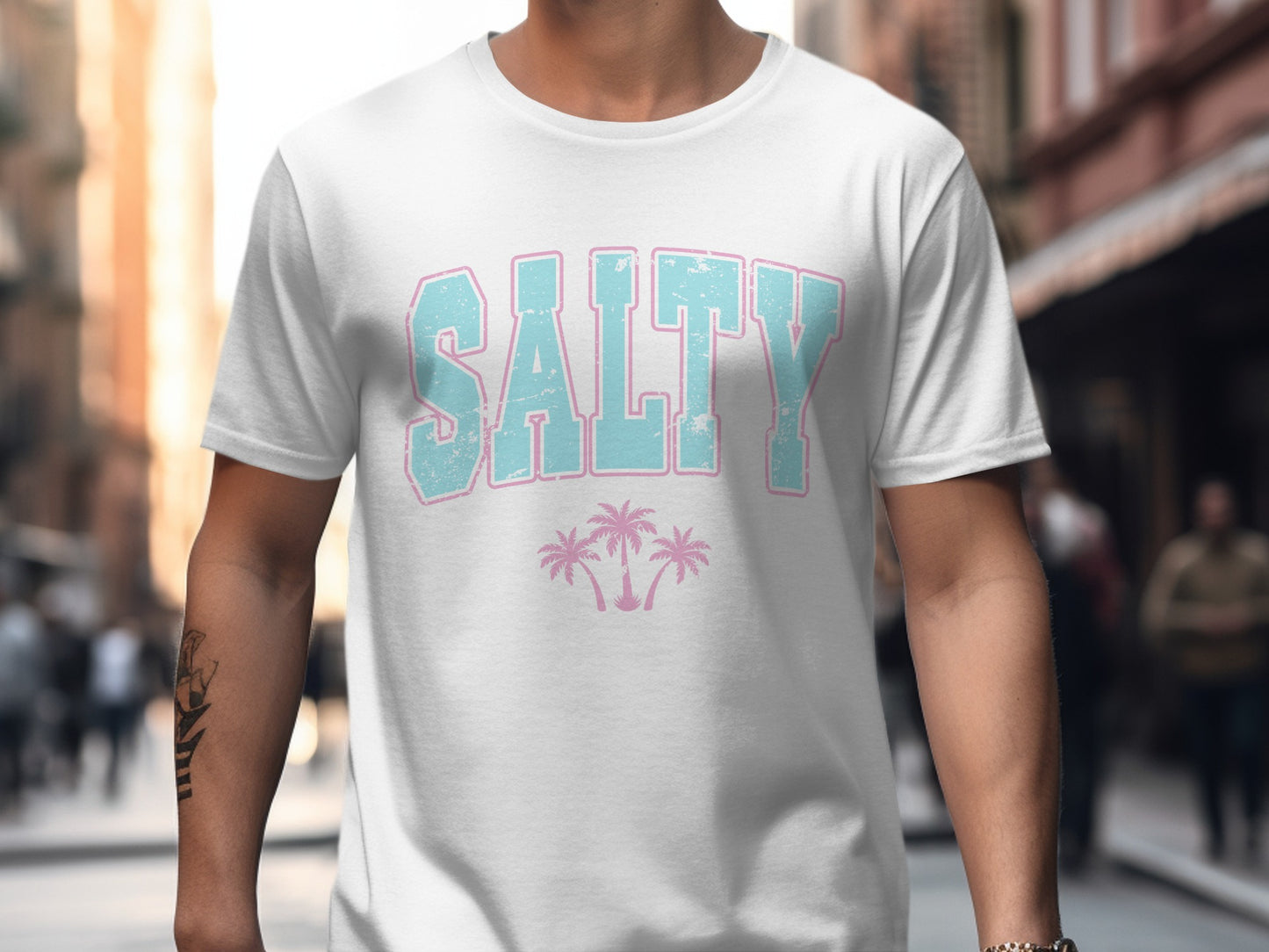 White t-shirt with "SALTY" and palm trees graphic.