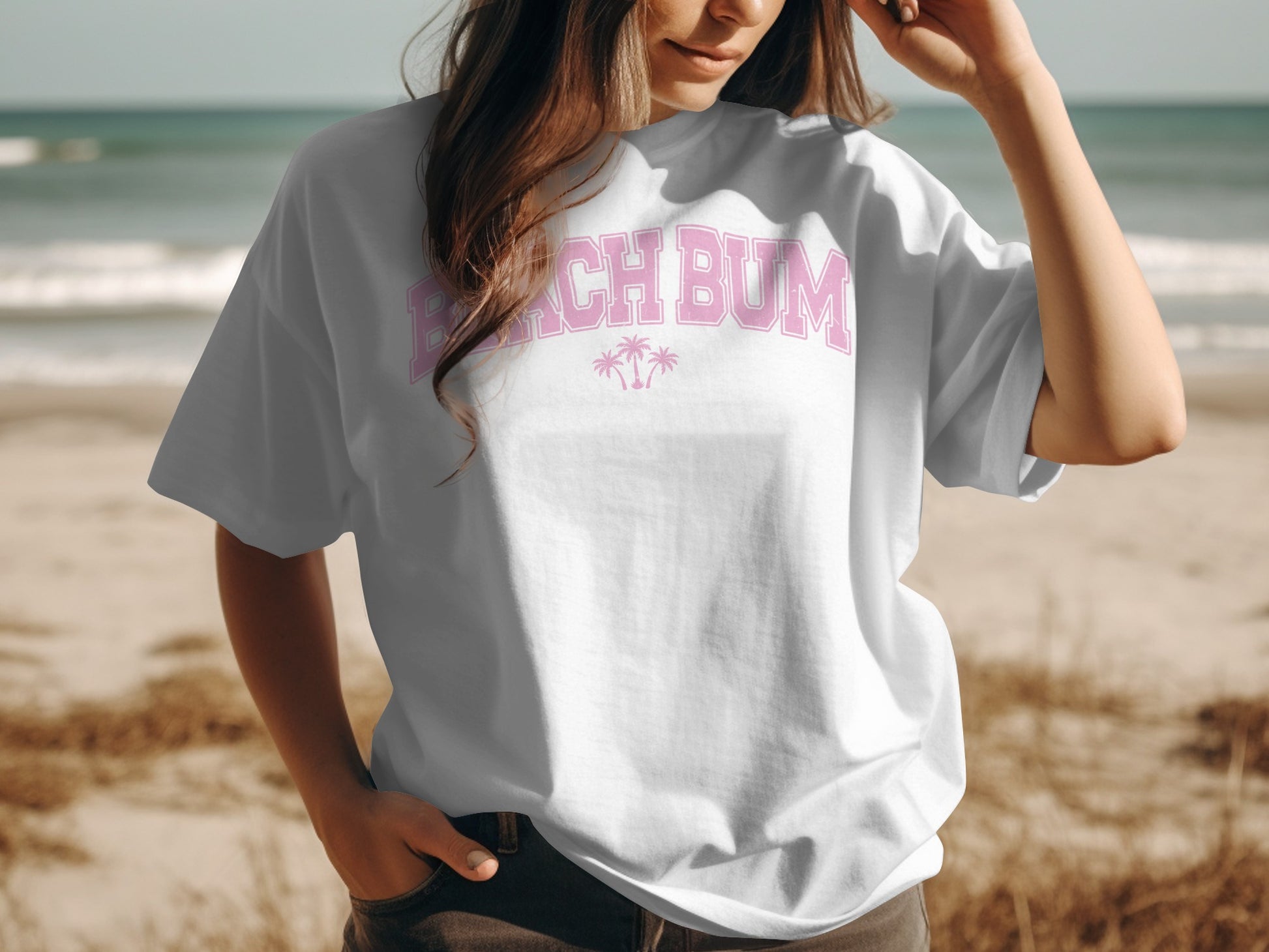 White t-shirt with pink "Beach Bum" text and palm trees.